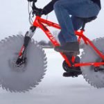 Ice-biker mods his cycle with buzz-saw wheels (crazy projects). Ice-biker mods his cycle with buzz-saw wheels (crazy projects).
