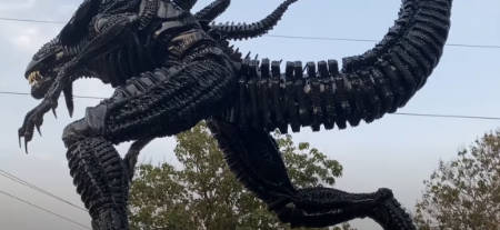 Alien King sculpture: never tyre'd (lifesize xenomorph made from old tyres).